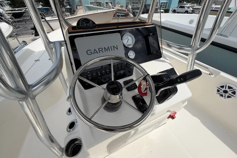 Slide: The Image of 2027 Bulls Bay 2200 XS boat console with Garmin navigation system and steering wheel. - 7