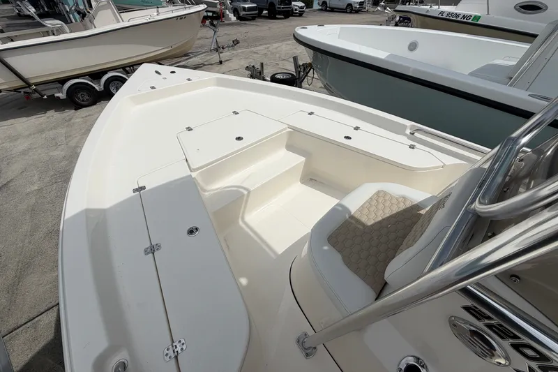 Slide: The Image of 2027 Bulls Bay 2200 XS boat interior with seating and storage compartments. - 8