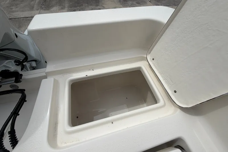 Slide: The Image of Open storage compartment on a 2027 Bulls Bay 2200 XS boat, showcasing interior space. - 18