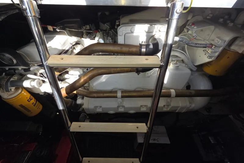 Slide: The Image of Engine compartment of a 1991 Sea Ray 420 Sundancer with visible ladder and components. - 30