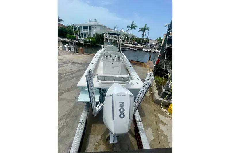 Slide: The Image of 2022 Dorado 25 FD boat with Mercury 300 engine docked at marina. - 9