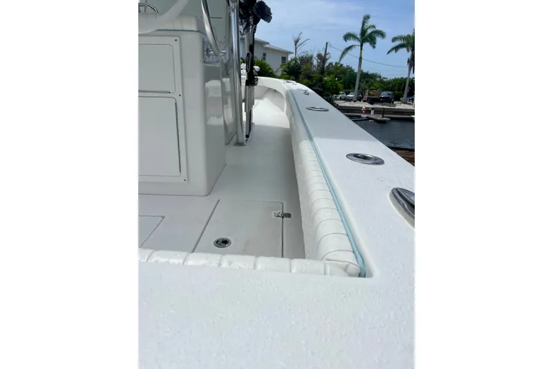 Slide: The Image of 2022 Dorado 25 FD boat deck with sleek white finish and modern design. - 18