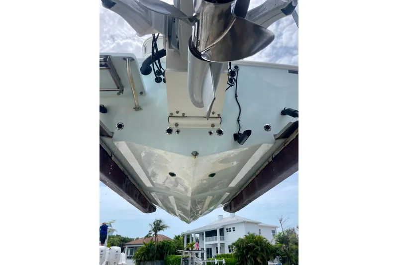 Slide: The Image of Underneath view of a 2022 Dorado 25 FD boat, showcasing hull and propeller. - 21