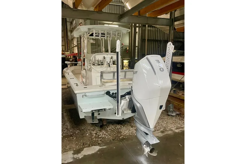 Slide: The Image of 2022 Dorado 25 FD boat with Mercury outboard motor in storage facility. - 35