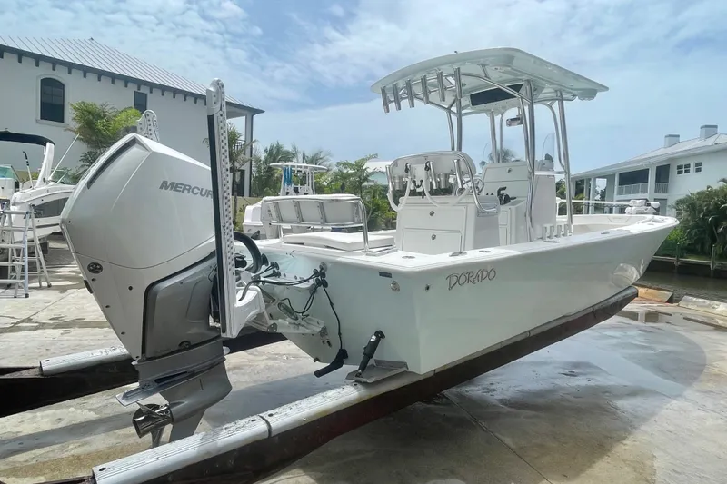 Slide: The Image of 2022 Dorado 25 FD boat with Mercury engine on a dock. - 4