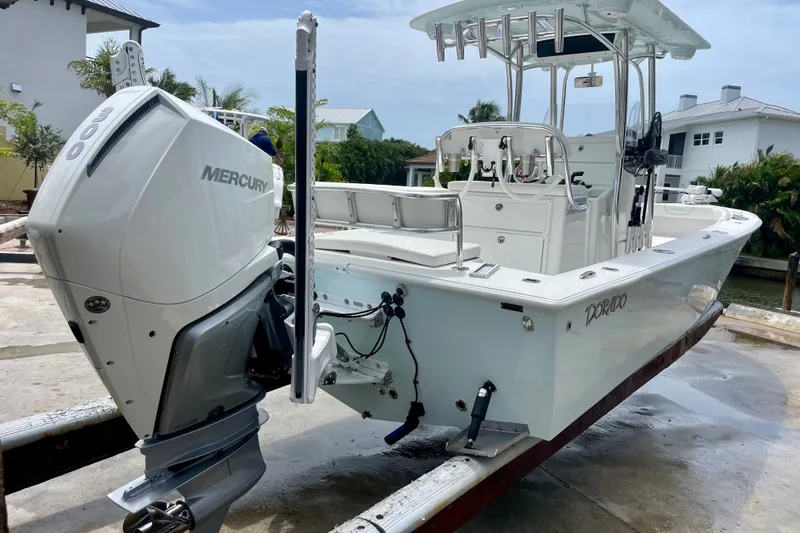 Slide: The Image of 2022 Dorado 25 FD boat with Mercury engine, docked outdoors. - 7
