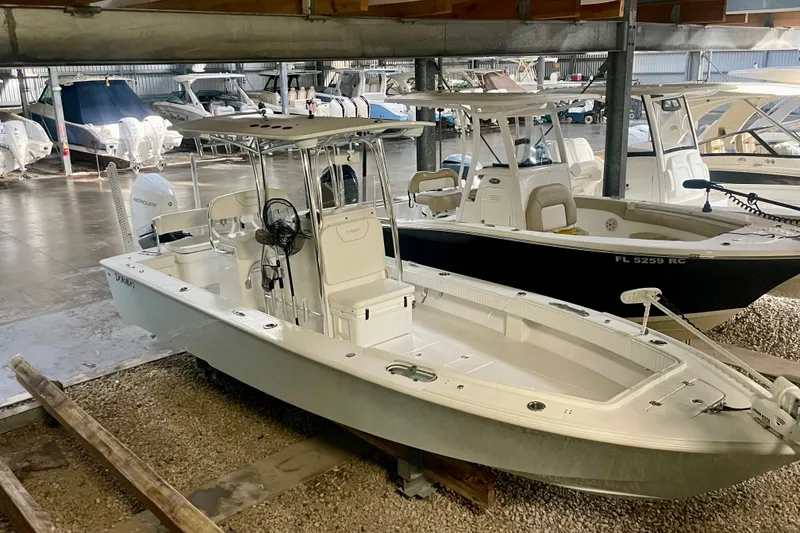 Slide: The Image of 2022 Dorado 25 FD boat in storage, featuring sleek design and modern amenities. - 32