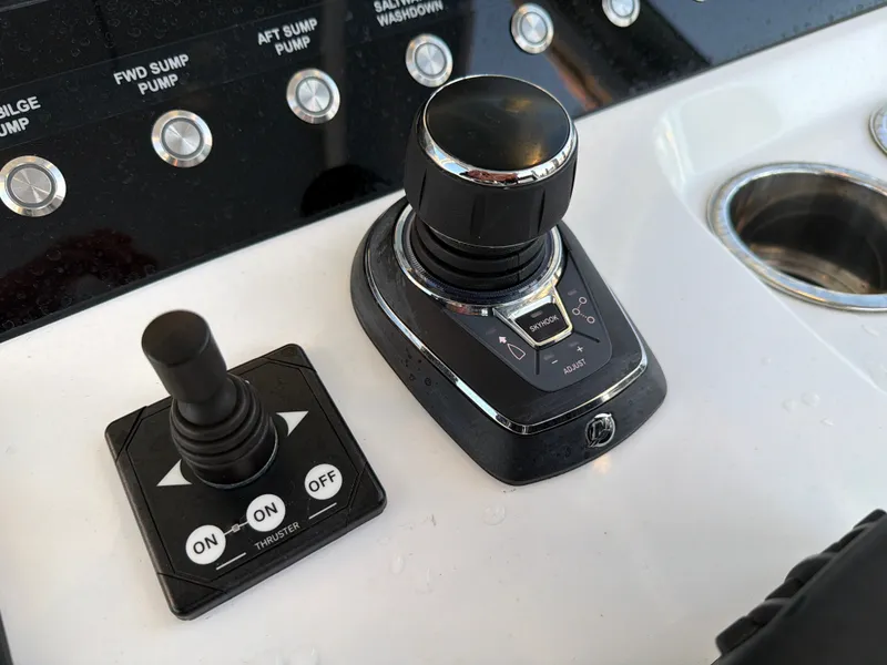 Slide: The Image of Close-up of the control console with joystick and controls. - 47