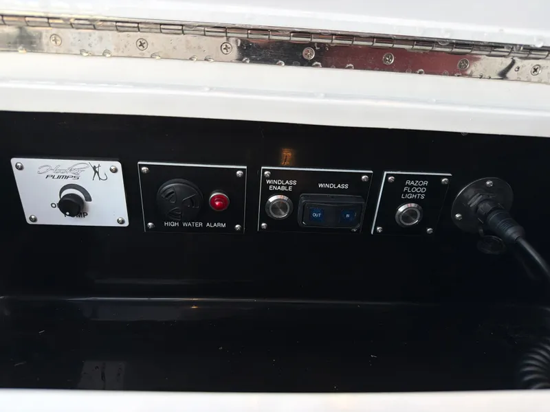 Slide: The Image of The image shows a control panel with switches and indicators on a boat. - 50