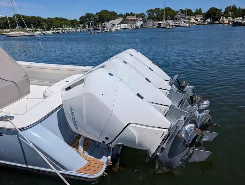 Slide: The Image of The image shows a 2026 Valhalla V-41 boat with four Mercury outboard engines in the water. - 21