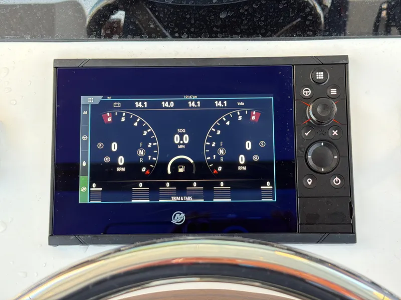 Slide: The Image of A modern boat instrument display with tachometers and controls. - 43