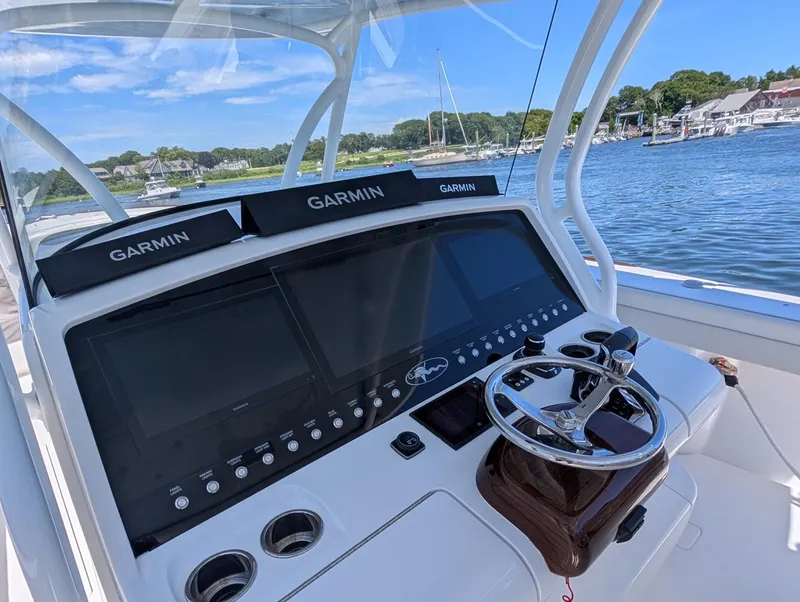 Slide: The Image of The image shows the helm of a Valhalla V-41 boat with multiple Garmin screens. - 24