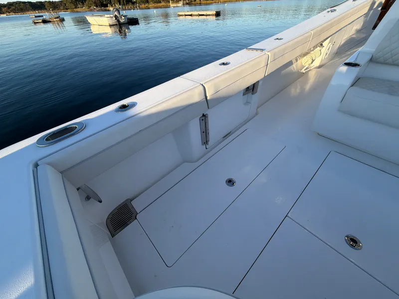 Slide: The Image of The image shows the deck of a 2026 Valhalla V-41 boat with white upholstery. - 33