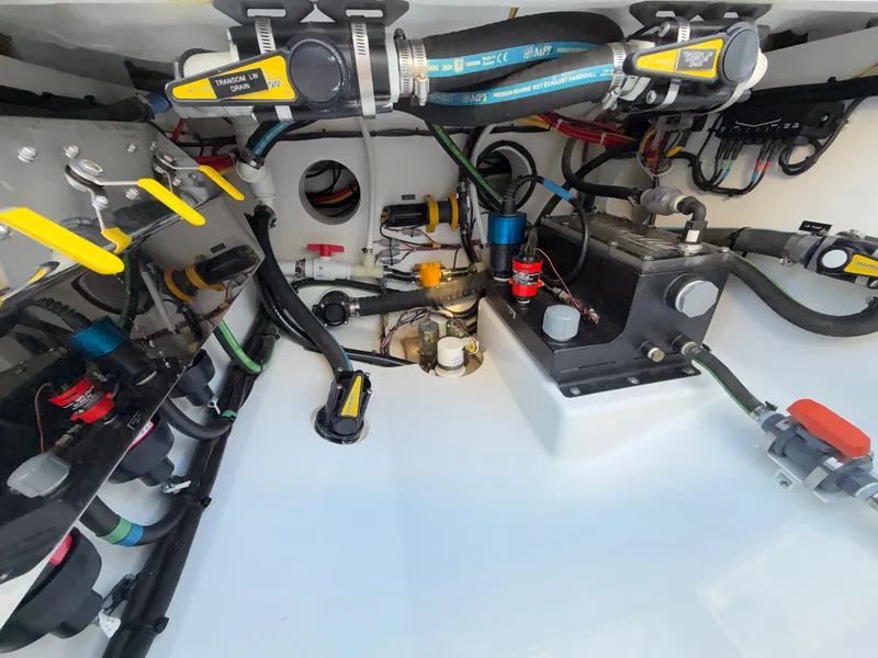 Slide: The Image of The engine room of a 2026 Valhalla V-41 features hoses, valves, and electrical connections. - 29