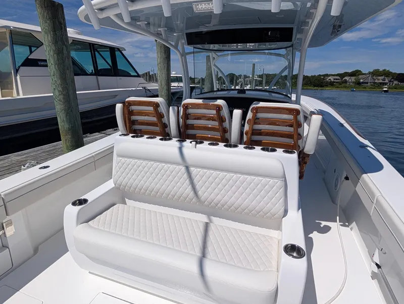 Slide: The Image of The image shows the cockpit of a 2026 Valhalla V-41 boat with white upholstery. - 23