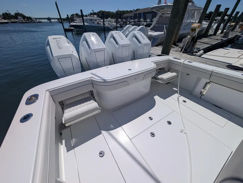Slide: The Image of The image shows the stern of a Valhalla V-41 boat with four outboard engines. - 22