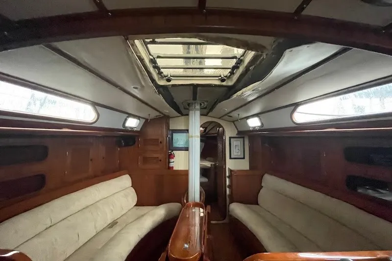 Slide: The Image of Interior of 1984 Robert Perry Nassau Tatoosh 42 sailboat with wooden finish and seating. - 13