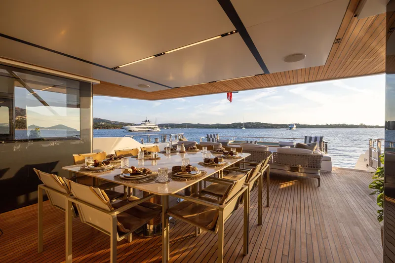 Slide: The Image of Luxurious 2025 Alpha 100 Squalo yacht deck with elegant dining area and ocean view. - 45