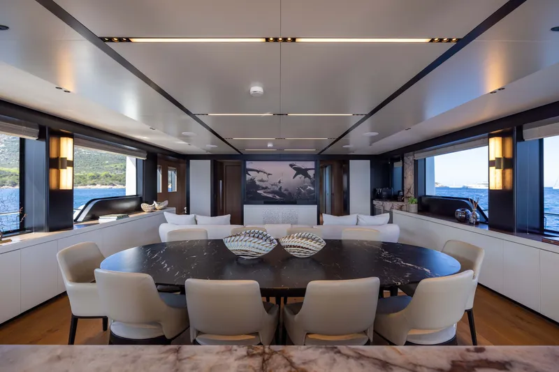 Slide: The Image of Luxurious interior of 2025 Alpha 100 Squalo yacht with elegant dining area and ocean views. - 24