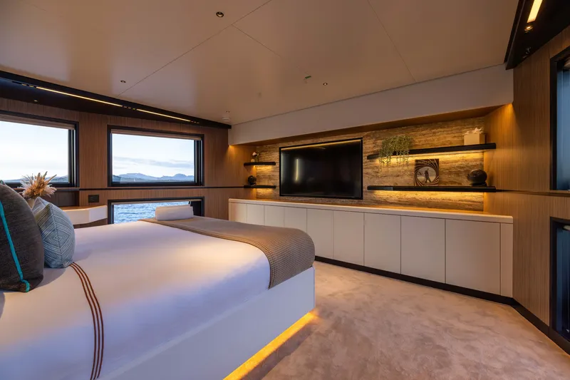 Slide: The Image of Luxurious bedroom interior on Alpha 100 Squalo yacht, 2025 model, featuring modern design and ocean views. - 49