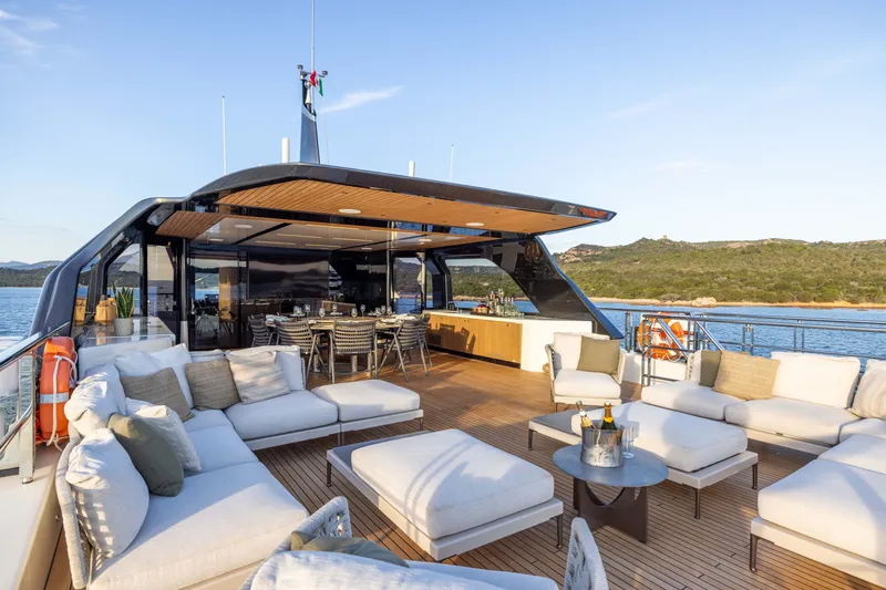 Slide: The Image of Luxurious 2025 Alpha 100 Squalo yacht with elegant outdoor seating and dining area. - 54