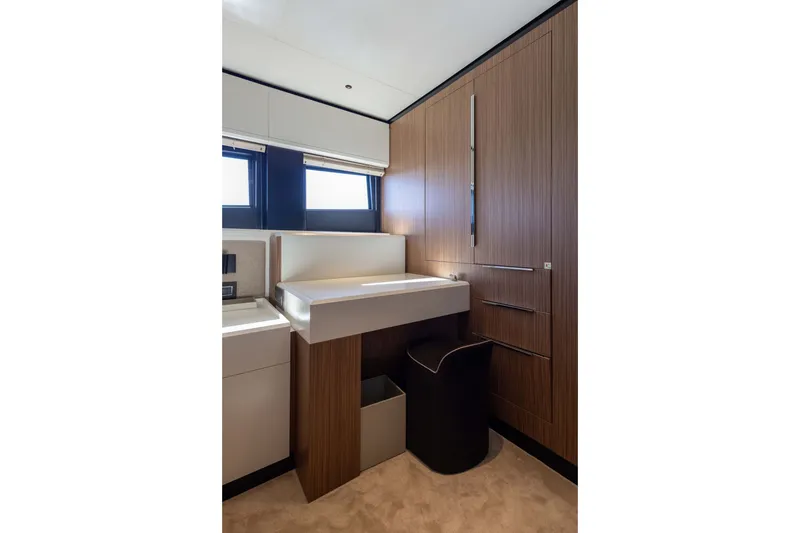 Slide: The Image of Modern bathroom interior in 2025 Alpha 100 Squalo yacht, featuring sleek wood paneling and minimalist design. - 63
