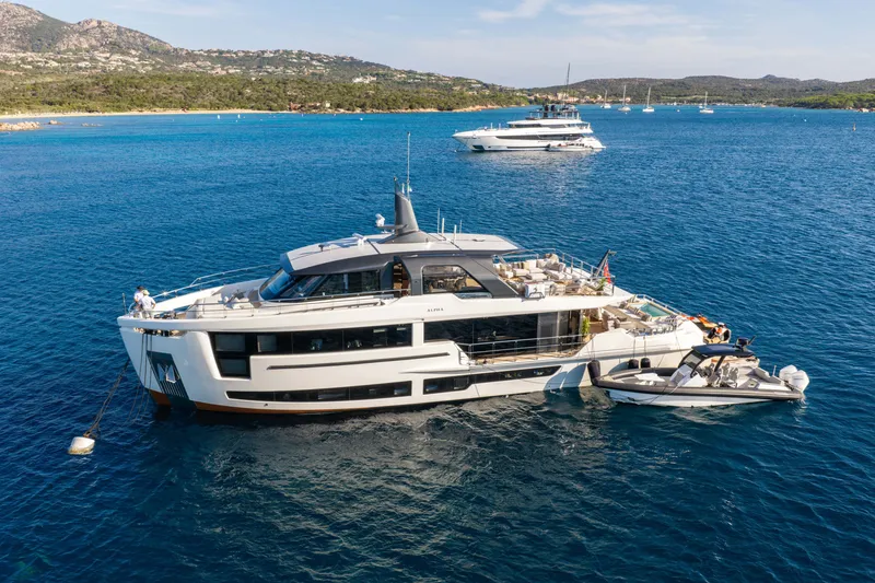 The Image of Luxury yacht Alpha 100 Squalo 2025 anchored in scenic coastal waters. - 0