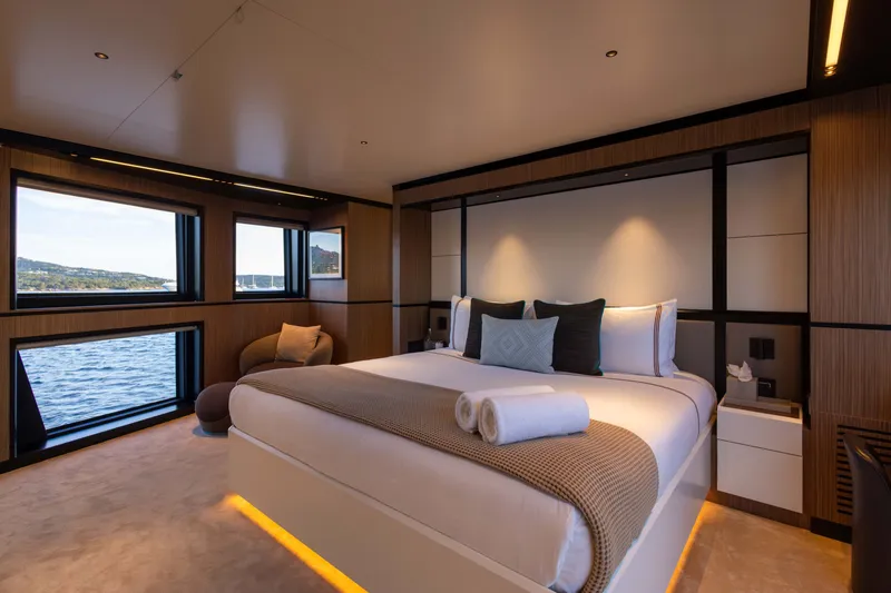 Slide: The Image of Luxurious bedroom on 2025 Alpha 100 Squalo yacht with ocean view and modern decor. - 28