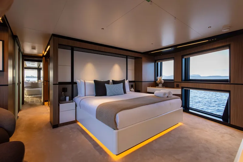 Slide: The Image of Luxurious bedroom on 2025 Alpha 100 Squalo yacht with ocean views and modern decor. - 27