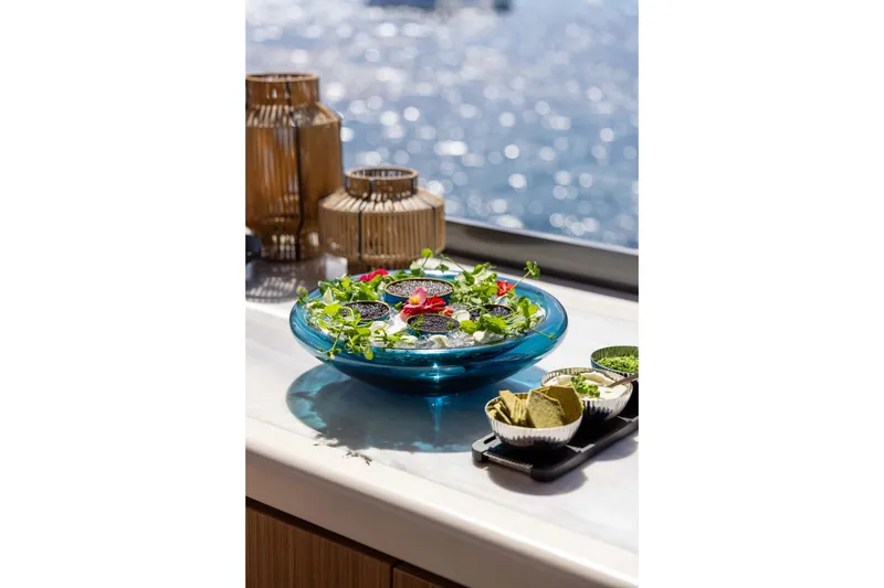 Slide: The Image of Luxurious dining setup on Alpha 100 Squalo yacht, featuring elegant tableware and ocean view. - 22