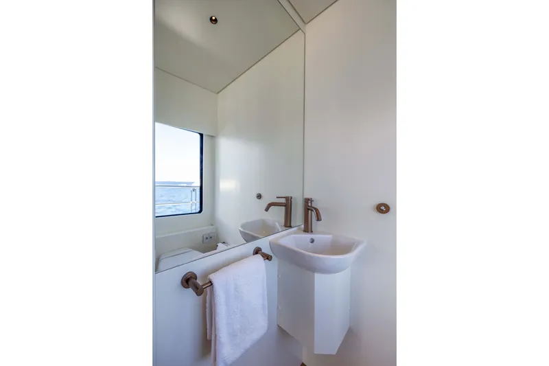 Slide: The Image of Modern bathroom with sleek sink and mirror in 2025 Alpha 100 Squalo yacht. - 37