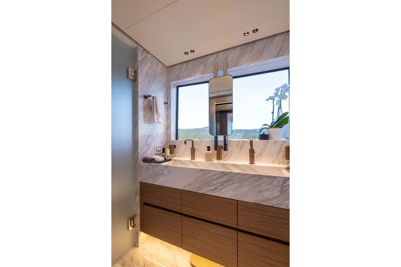 Slide: The Image of Luxurious bathroom interior with marble accents in the 2025 Alpha 100 Squalo yacht. - 42