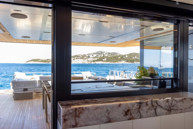 Slide: The Image of Luxurious 2025 Alpha 100 Squalo yacht interior with ocean view and elegant marble accents. - 33