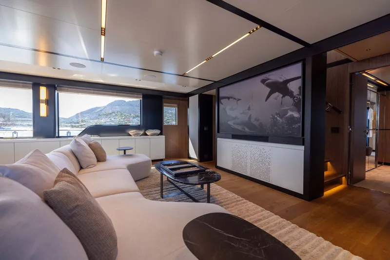 Slide: The Image of Luxurious interior of 2025 Alpha 100 Squalo yacht with modern decor and large windows. - 32