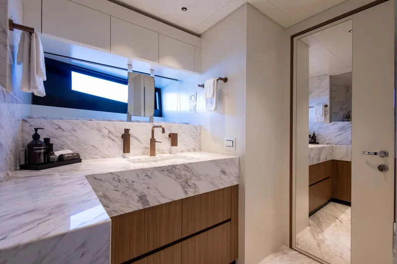 Slide: The Image of Luxurious bathroom interior on Alpha 100 Squalo 2025 yacht, featuring marble countertops and modern fixtures. - 58