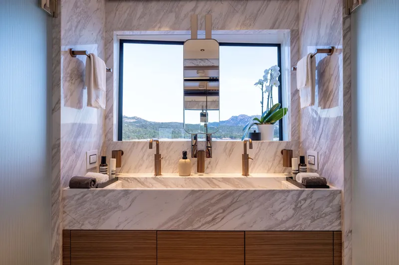 Slide: The Image of Luxurious marble bathroom with dual sinks, modern fixtures, and scenic mountain view. - 41