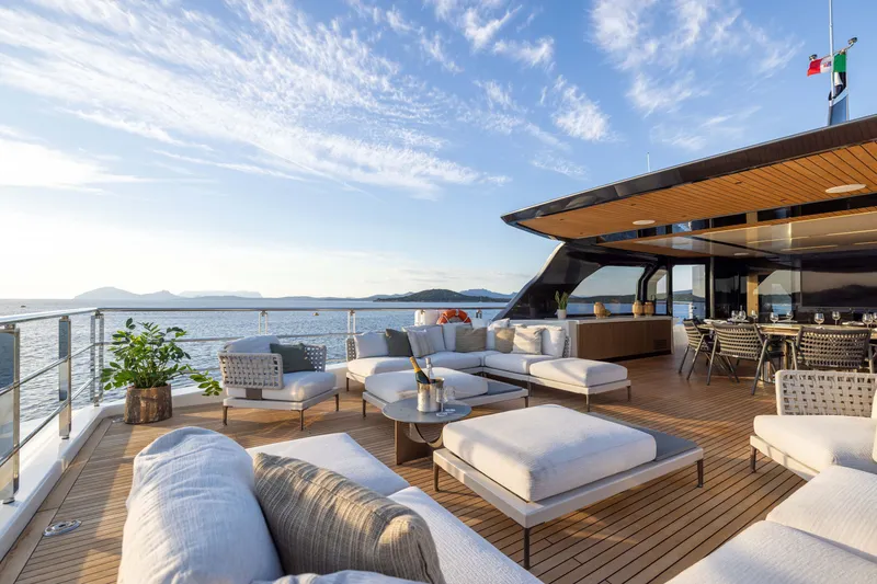 Slide: The Image of Luxurious 2025 Alpha 100 Squalo yacht deck with elegant seating and ocean view. - 53