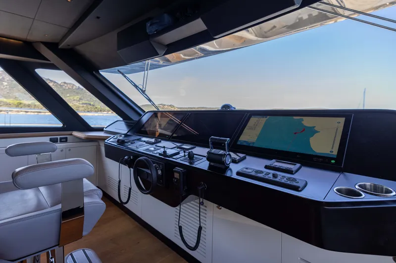 Slide: The Image of Cockpit of 2025 Alpha 100 Squalo yacht with navigation screens and controls. - 36