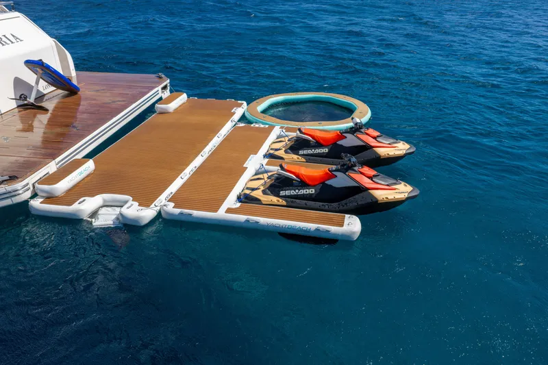 Slide: The Image of Floating dock with two Sea-Doo jet skis beside Alpha 100 Squalo yacht, 2025 model. - 14