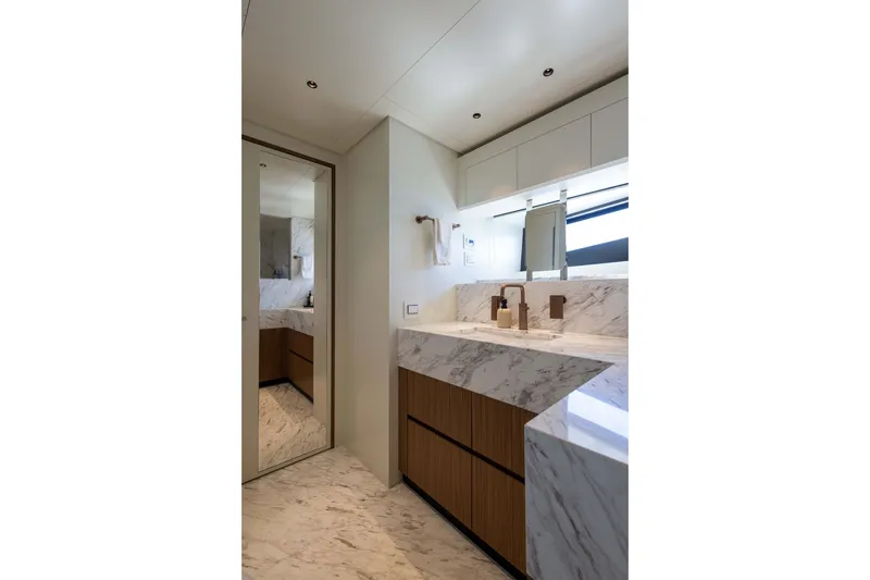 Slide: The Image of Luxurious bathroom in 2025 Alpha 100 Squalo yacht with marble countertops and modern fixtures. - 65