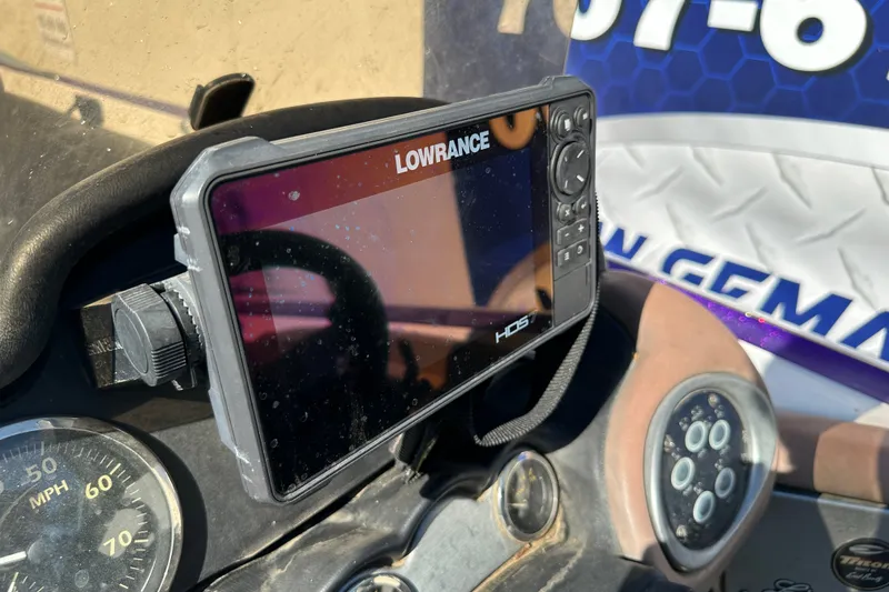 Slide: The Image of Lowrance HDS fishfinder on 2006 Triton TR-21 boat dashboard with speedometer. - 17
