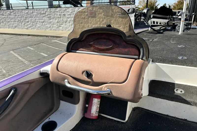 Slide: The Image of 2006 Triton TR-21 boat interior with windshield and storage compartment. - 14