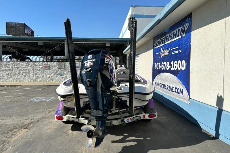 Slide: The Image of 2006 Triton TR-21 boat with Evinrude engine parked at Gone Fishin' Marine. - 7