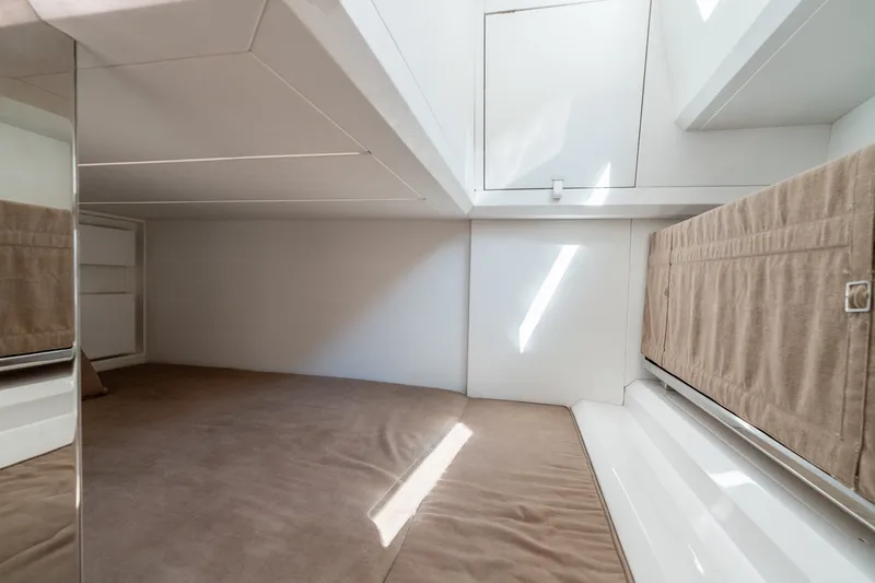 Slide: The Image of Interior cabin of 2023 Evo Yachts R4 WA, featuring sleek design and neutral tones. - 32