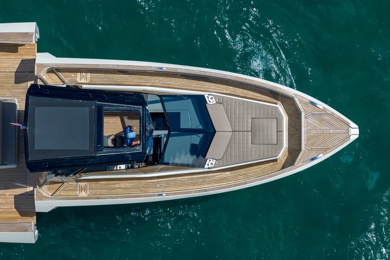Slide: The Image of Aerial view of 2023 Evo Yachts R4 WA luxury yacht on blue water. - 18
