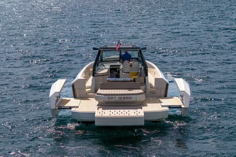 Slide: The Image of 2023 Evo Yachts R4 WA cruising on open water, rear view. - 12