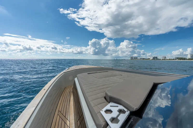 Slide: The Image of 2023 Evo Yachts R4 WA cruising on open sea under a clear blue sky. - 35