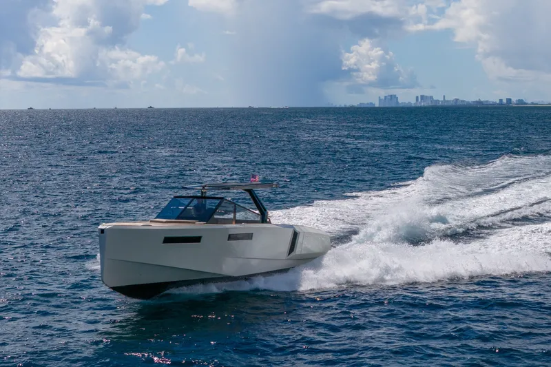 Slide: The Image of 2023 Evo Yachts R4 WA cruising on open sea under a partly cloudy sky. - 20