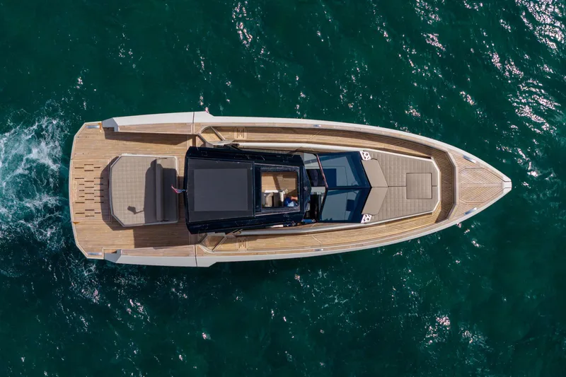 Slide: The Image of Aerial view of 2023 Evo Yachts R4 WA luxury yacht cruising on open water. - 11