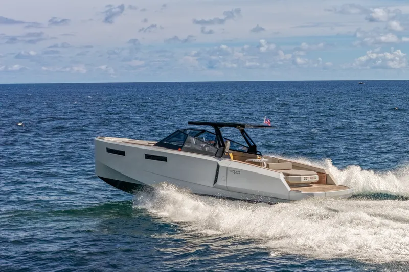 Slide: The Image of 2023 Evo Yachts R4 WA cruising on open sea under clear skies. - 21